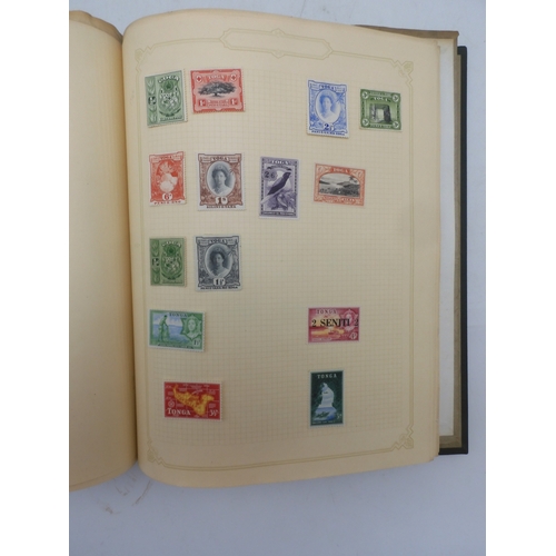 7045 - A worldwide stamp collection in four albums including 1 album of  GB with early phosphor sets, one a... 