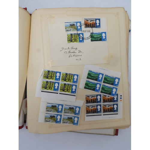 7045 - A worldwide stamp collection in four albums including 1 album of  GB with early phosphor sets, one a...