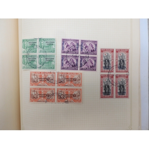 7045 - A worldwide stamp collection in four albums including 1 album of  GB with early phosphor sets, one a...