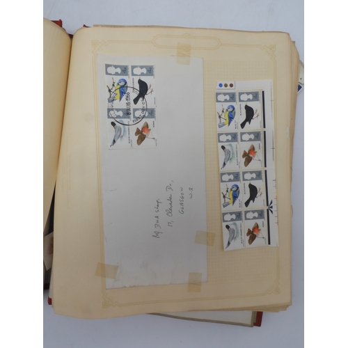 7045 - A worldwide stamp collection in four albums including 1 album of  GB with early phosphor sets, one a... 