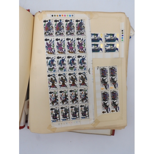 7045 - A worldwide stamp collection in four albums including 1 album of  GB with early phosphor sets, one a...