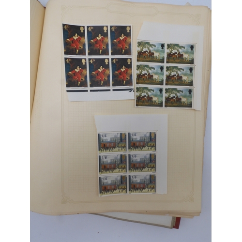 7045 - A worldwide stamp collection in four albums including 1 album of  GB with early phosphor sets, one a... 