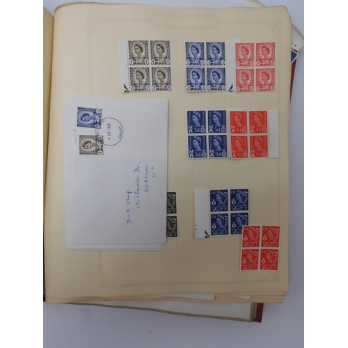 7045 - A worldwide stamp collection in four albums including 1 album of  GB with early phosphor sets, one a... 