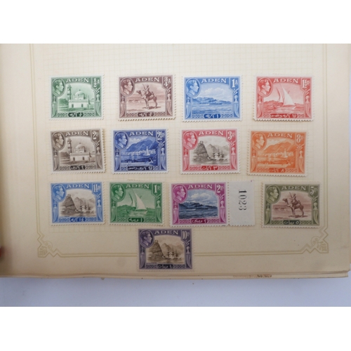 7045 - A worldwide stamp collection in four albums including 1 album of  GB with early phosphor sets, one a...