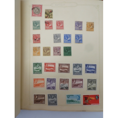 7045 - A worldwide stamp collection in four albums including 1 album of  GB with early phosphor sets, one a... 