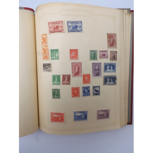 7045 - A worldwide stamp collection in four albums including 1 album of  GB with early phosphor sets, one a...