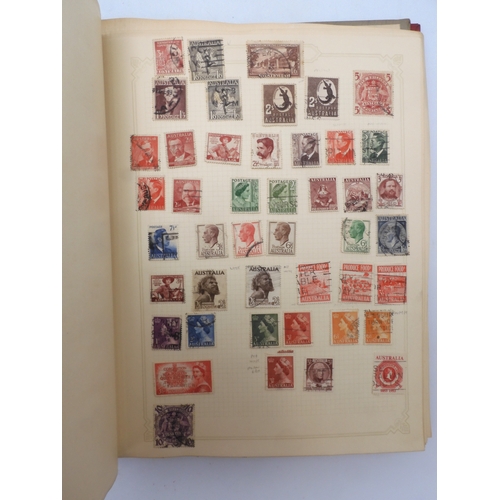 7045 - A worldwide stamp collection in four albums including 1 album of  GB with early phosphor sets, one a... 