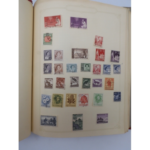 7045 - A worldwide stamp collection in four albums including 1 album of  GB with early phosphor sets, one a...