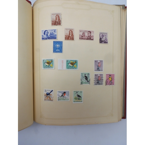 7045 - A worldwide stamp collection in four albums including 1 album of  GB with early phosphor sets, one a... 