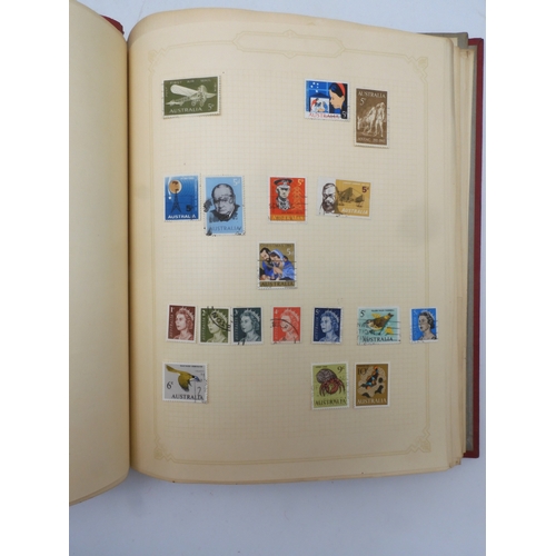 7045 - A worldwide stamp collection in four albums including 1 album of  GB with early phosphor sets, one a...