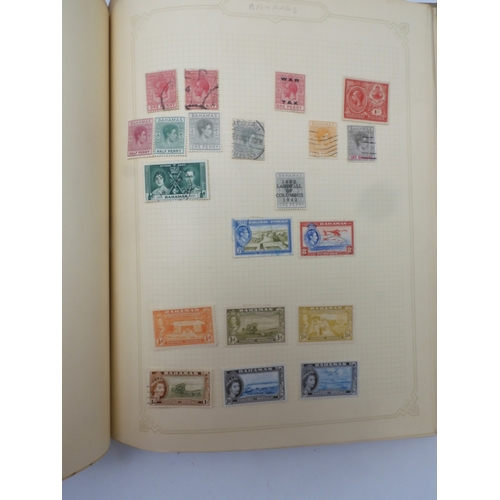 7045 - A worldwide stamp collection in four albums including 1 album of  GB with early phosphor sets, one a... 