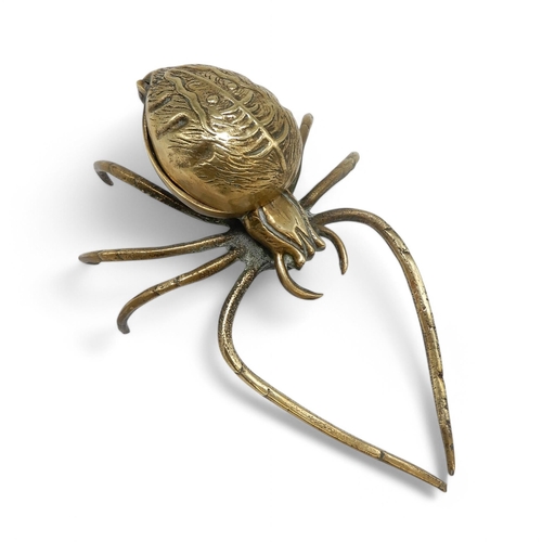 2151A - A NOVELTY VICTORIAN BRASS INKWELLin the form of a spider, the hinged abdomen opening to a well, regi... 