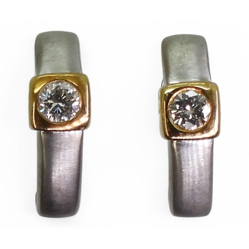 700 - A pair of 18ct white and yellow gold diamond earrings, set with estimated approx 0.50cts of brillian... 