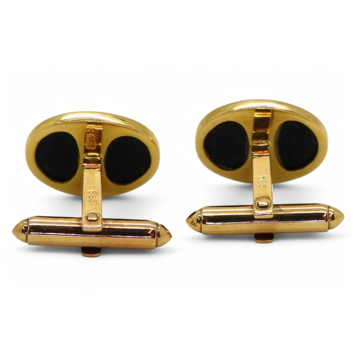 704 - A pair of 14k gold Chinese symbol and onyx cufflinks, weight together 7.2gms