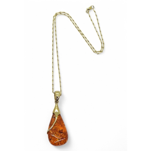 725 - A 9ct gold mounted amber pendant on a 45cm barley corn chain, weight 12.2gms