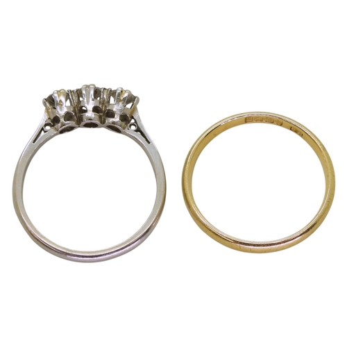 742 - An 18ct gold wedding ring hallmarked Birmingham 1936, weight 1.7gms, together with a classic three s... 