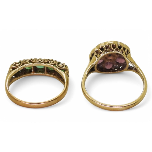 745 - A 9ct gold garnet and diamond cluster ring, size M, and a emerald eternity ring with scrolled mount ... 