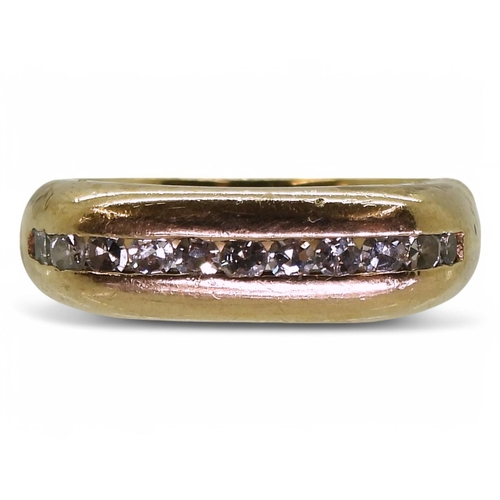 751 - A 9ct gold eternity ring with a rounded square profile channel set with estimated approx 0.20cts of ... 