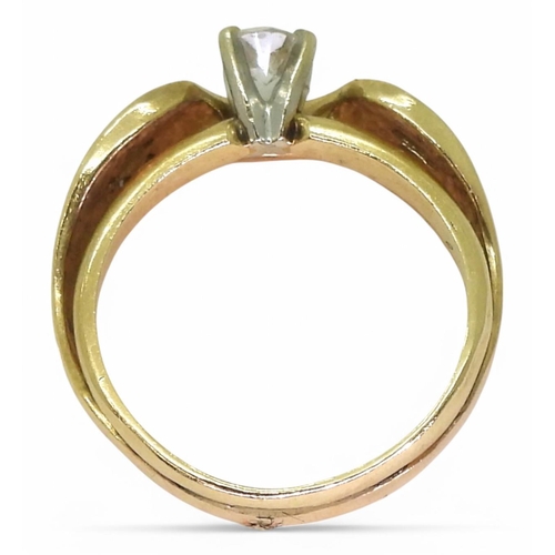 753 - A 14k gold diamond set wave ring, the principle diamond is estimated approx at 0.20cts, with further... 