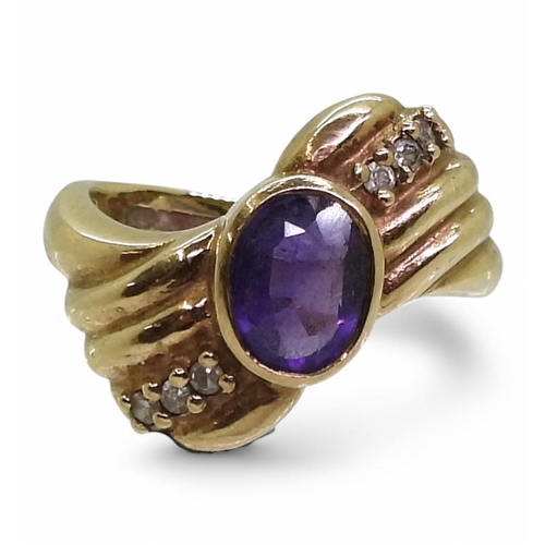 757 - A 9ct gold amethyst and diamond dress ring, size N, weight 5.2gms