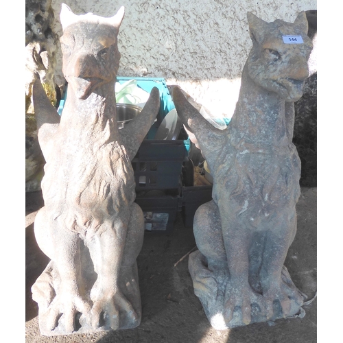 144 - A pair of contemporary reconstituted stone Hippogryph statues, 75cm high (one with snapped wing tip)... 