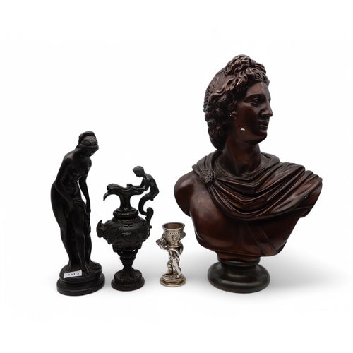 151 - A spelter figure modelled as a classical female,  a decorative jug with goat head and Bacchus handle... 