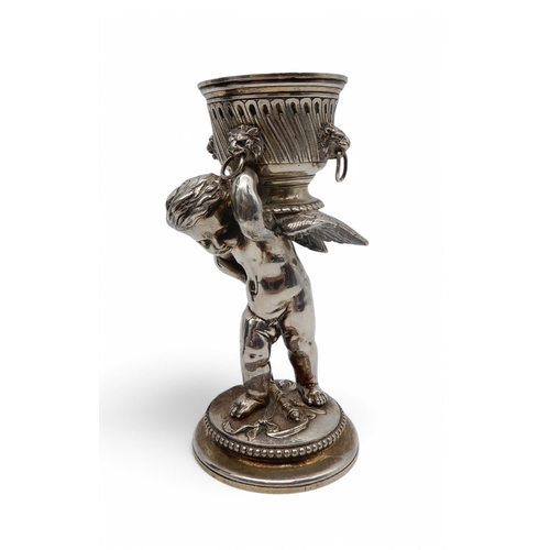 151 - A spelter figure modelled as a classical female,  a decorative jug with goat head and Bacchus handle... 