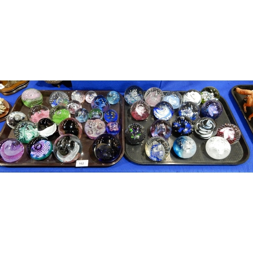 162 - A large quantity of Caithness and other glass paperweights