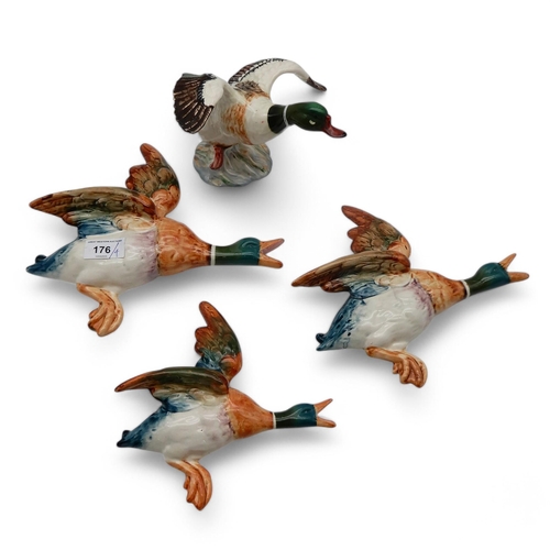 176 - Three graduating Beswick flying Ducks numbers 596/1, 596/2 and 596/3, together with a Sheldrake Duck... 