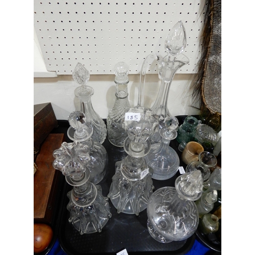 185 - A collection of glass and crystal decanters, varying ages