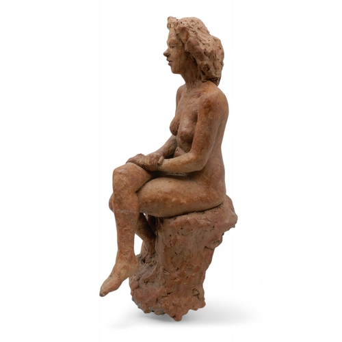 230 - T A Cockburn - A terracotta figure of a seated female nude