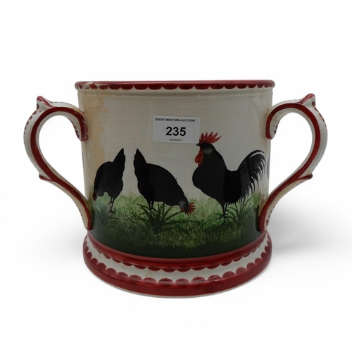 235 - A Wemyss black cockerel and hens tyg, restored