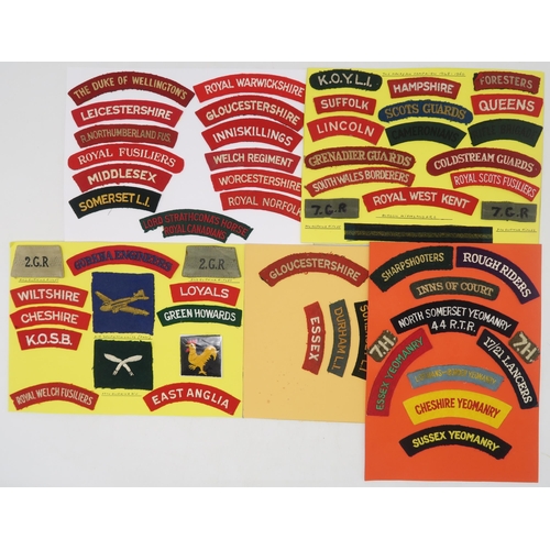 382 - A collection of military embroidered cloth shoulder titles and other cloth uniform insignia, to incl... 