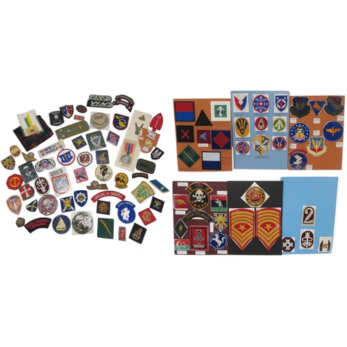 388 - An assortment of military cloth uniform cloth insignia, to include Royal Horse Artillery, Parachute ... 