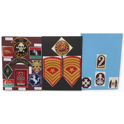 388 - An assortment of military cloth uniform cloth insignia, to include Royal Horse Artillery, Parachute ... 