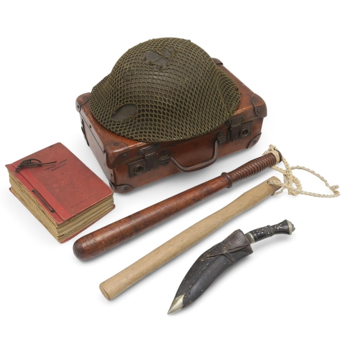 392 - Mixed militaria, to include a British Brodie helmet with net cover engraved 