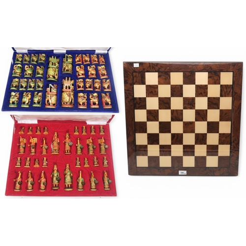 396 - Two cased large-scale Indian chess sets, with a burrwood Sorrento-made board measuring approx. 56cm ... 