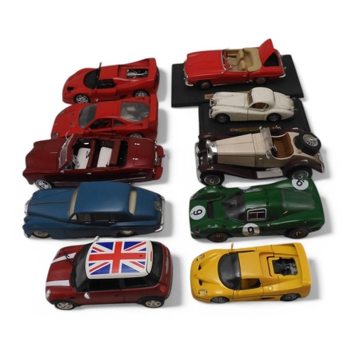 479 - A collection of loose diecast model cars, with examples by Maisto, Polistil Tonka, Universal Hobbies... 