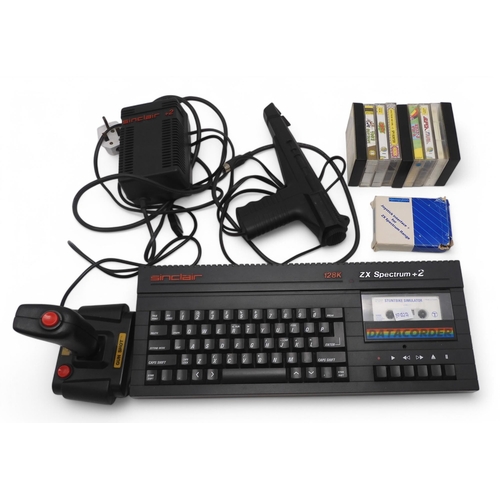 486 - A Sinclair ZX Spectrum +2 computer console, with joystick, boxed joystick interface, pistol and asso... 