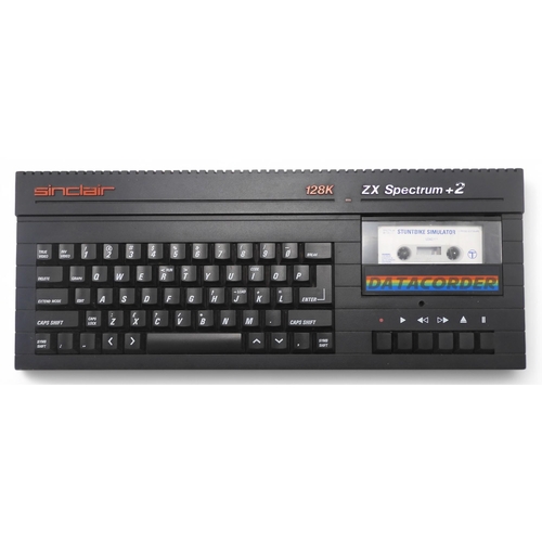 486 - A Sinclair ZX Spectrum +2 computer console, with joystick, boxed joystick interface, pistol and asso... 