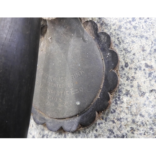 493 - A pair of Edwardian granite curling stones, with one handle engraved 