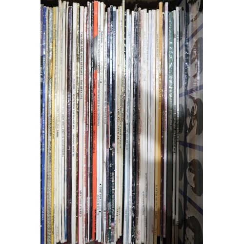 352 - VINYL RECORDS a good box of LP records with Fleetwood Mac, The Beatles, Eagles, Santana, Elton John,... 