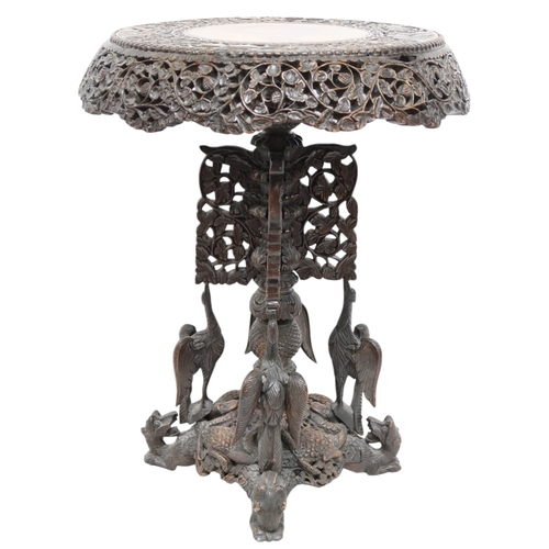 2039B - AN EARLY 20TH CENTURY BURMESE HARDWOOD TILT TOP TABLEcircular carved top with carved/pierced foliate... 