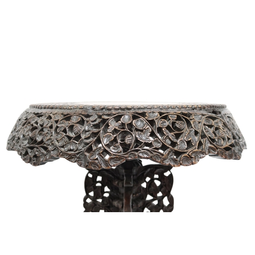 2039B - AN EARLY 20TH CENTURY BURMESE HARDWOOD TILT TOP TABLEcircular carved top with carved/pierced foliate... 