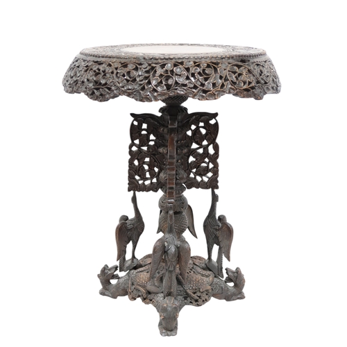 2039B - AN EARLY 20TH CENTURY BURMESE HARDWOOD TILT TOP TABLEcircular carved top with carved/pierced foliate... 