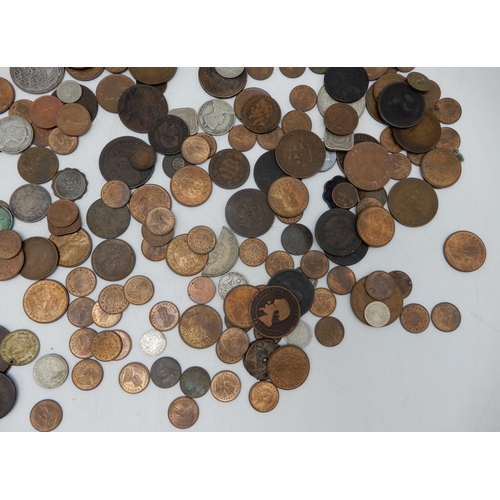 328B - A lot comprising various worldwide coins to include British colonial examples