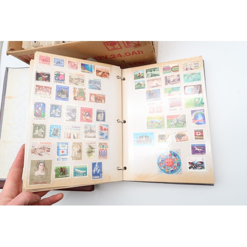 500A - WORLD STAMPS; a collection of three stamp albums, loose stamps and a box of card backed stamps 