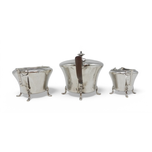 2309 - CHRISTOPHER DRESSER FOR HUKIN & HEATH;A three piece silver-plated tea service, of stylised form,... 
