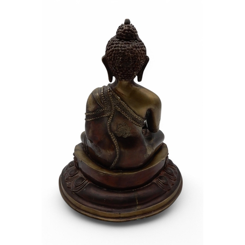157 - A bronze buddha in seated position