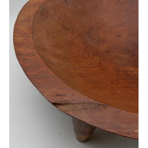 158 - A large Fijian Kava hardwood bowl on legs, together with a softwood dish on stand and a tray